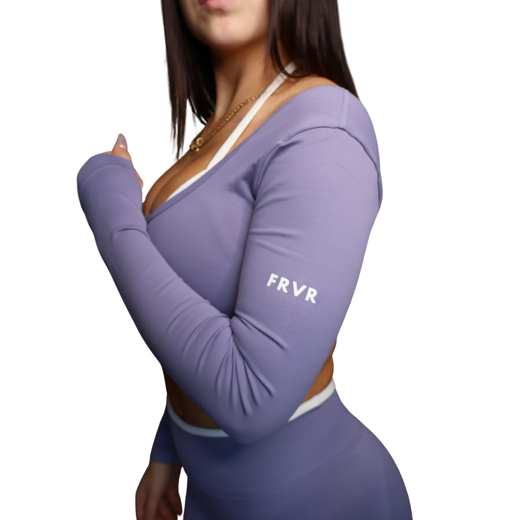 Purple long-sleeve top with 'FRVR' branding on a white background