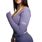Purple long-sleeve top with 'FRVR' branding on a white background