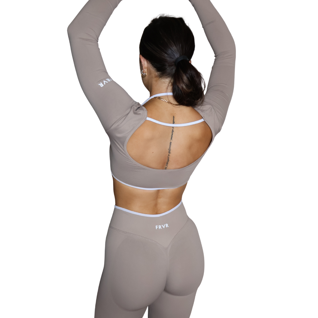 Womens long sleeve sports bra. Open back top of the gym.